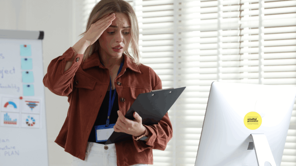 woman presenting holding head looking nervous