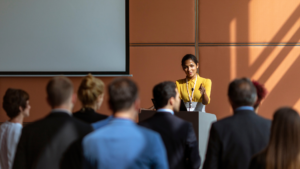 woman presenting to an audience