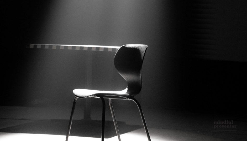 empty chair in spotlight