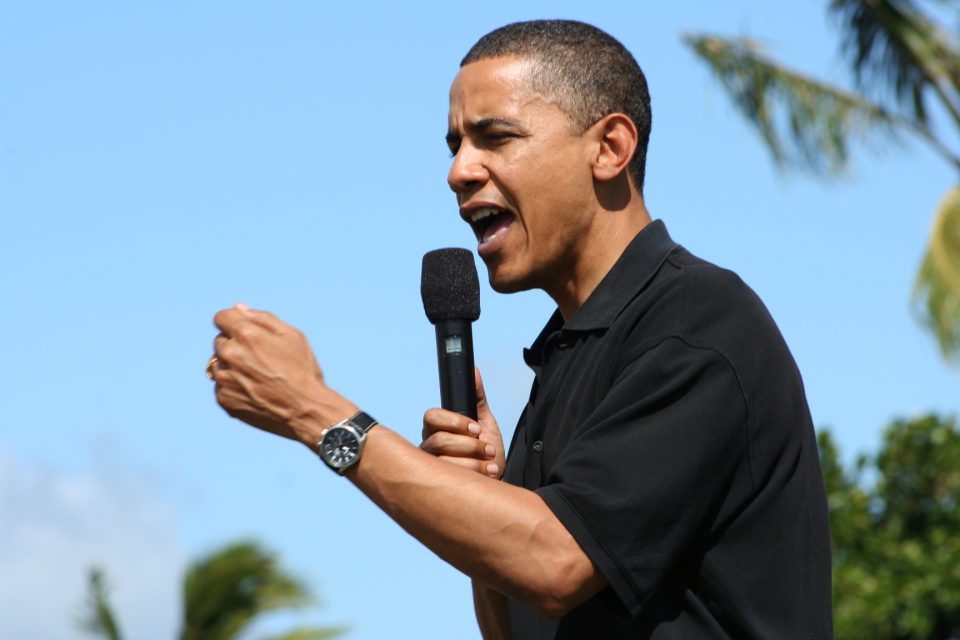 Barack Obama holding microphone
