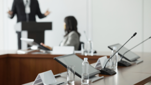 Man presenting behind a lectern