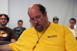 man sleeping at conference
