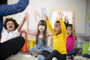 Young children sitting in classroom