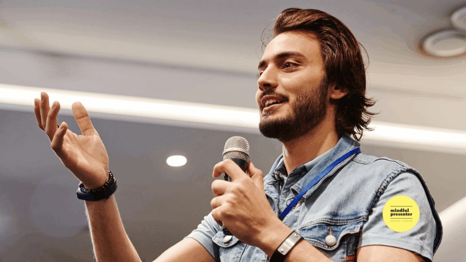 man speaking into a microphone