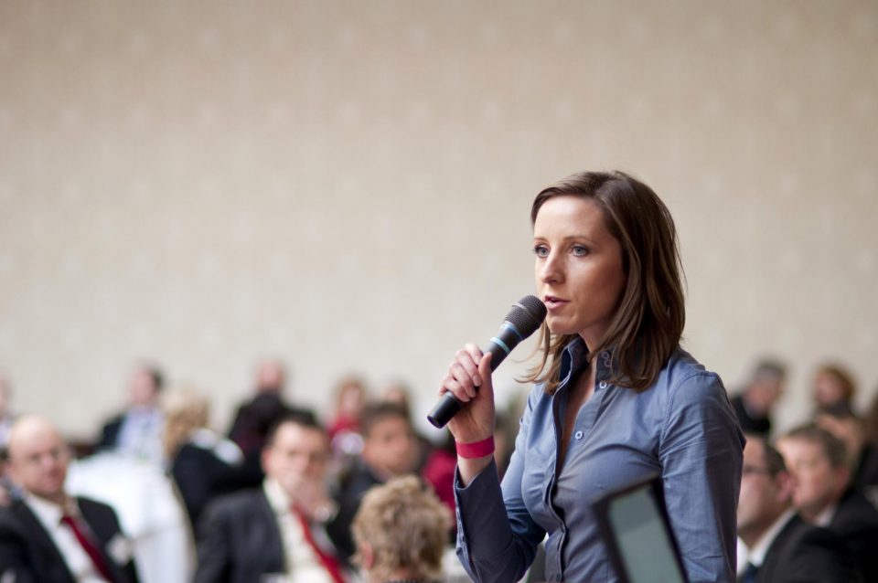 woman holding microphone