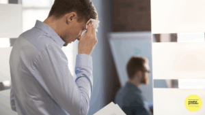 man looking nervous holding notes