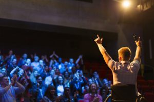 man presenting to big audience