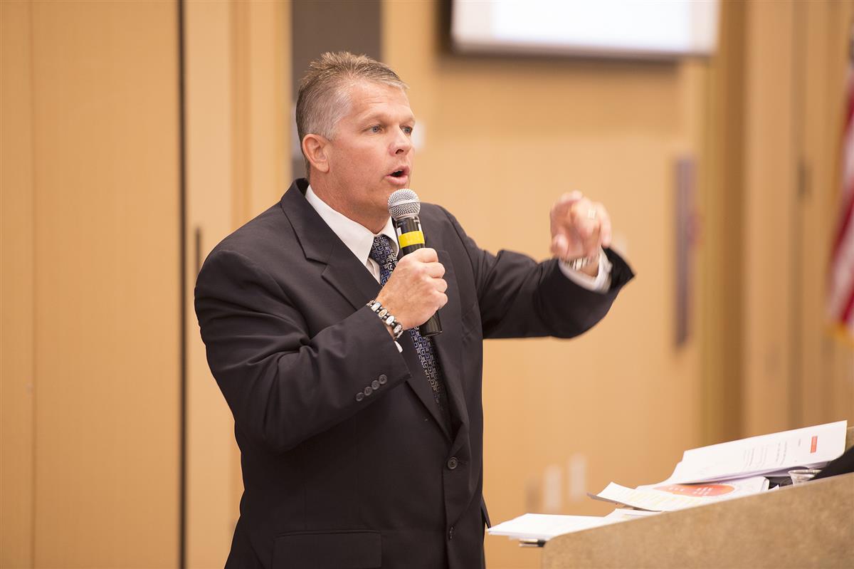 man speaking at conference