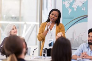 woman presenting using microphone