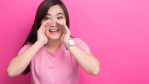 woman in pink top shouting