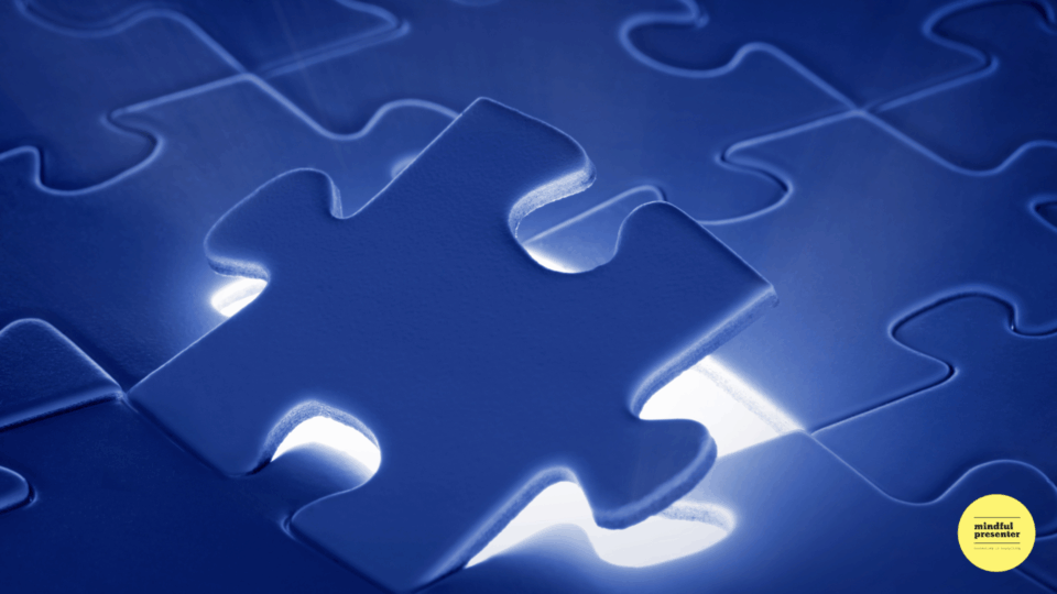 Puzzle of blue pieces with the last piece lighting up