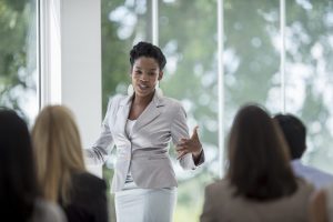 woman presenting to audience