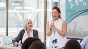 woman presenting on microphone