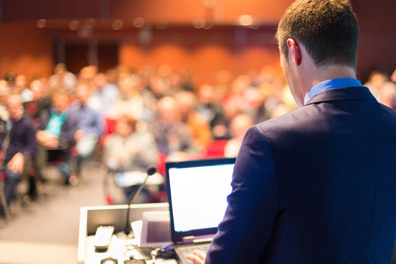 Man speaking at conference