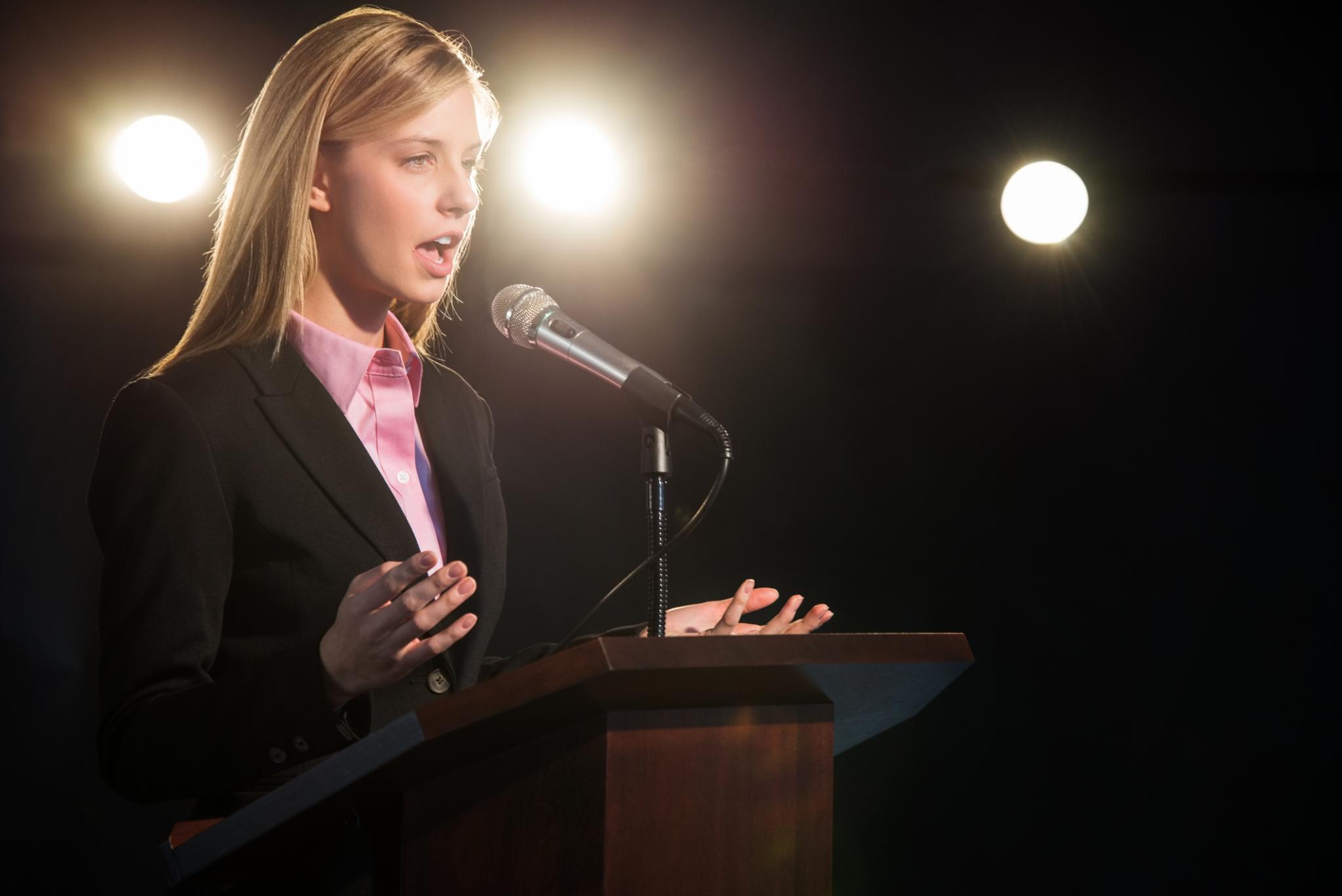 Lady speaking at a conference