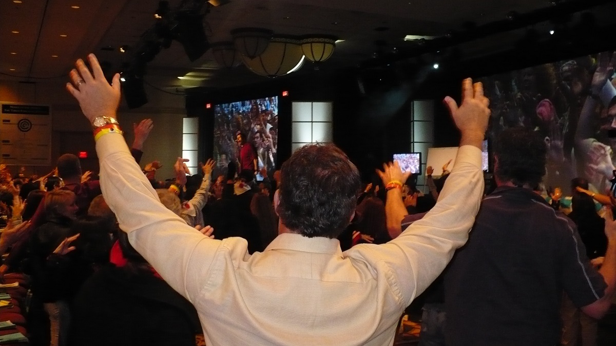 Public speaker with his back turned