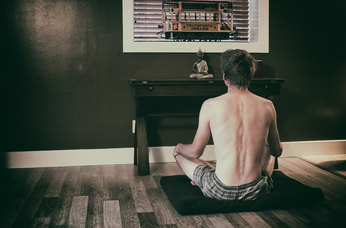 Man sitting meditating