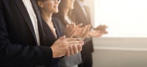 Closeup of business people hands clapping at conference