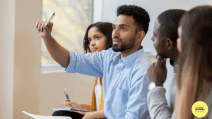 Man holding hand up to ask a question in a meeting
