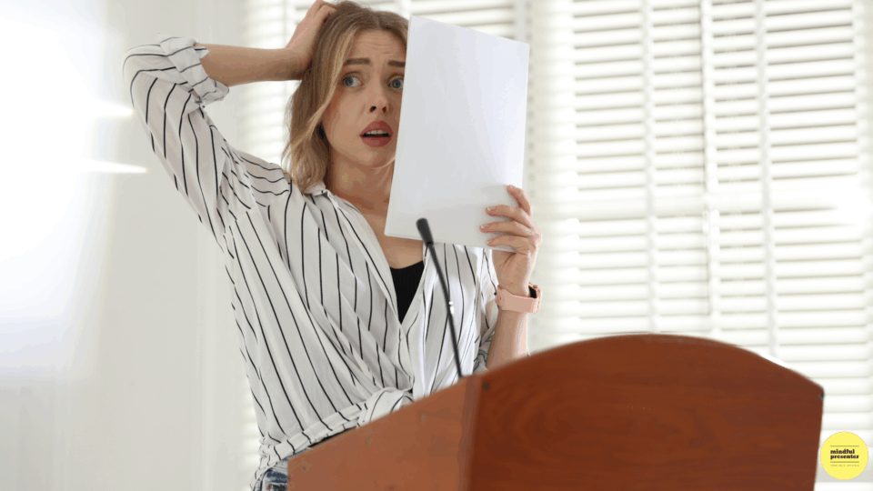 woman presenter with hand on head looking nervous