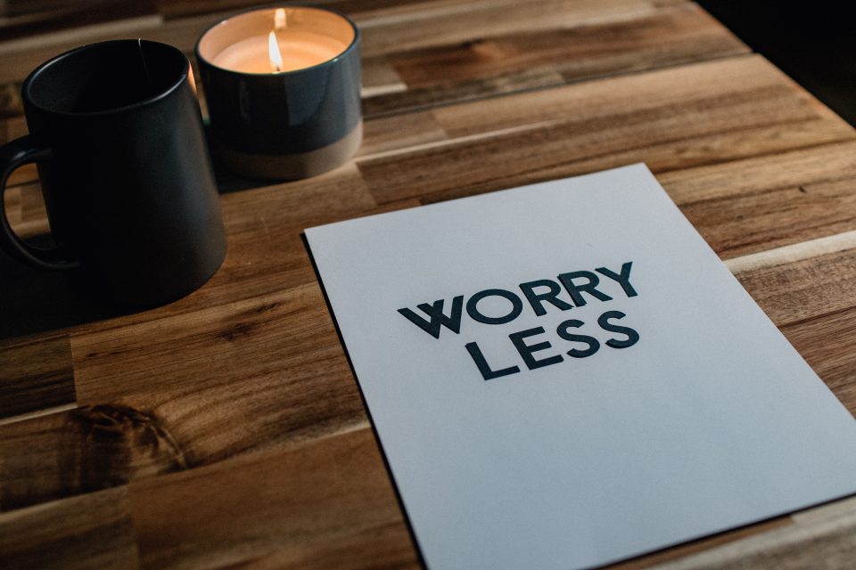 worry less written on A4