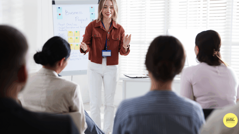 woman smiling presenting to audience