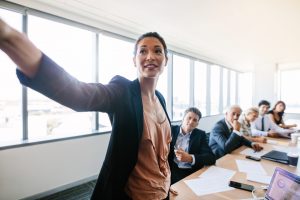 Lady presenting at a conference