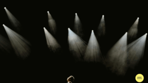 spotlights shining over a man