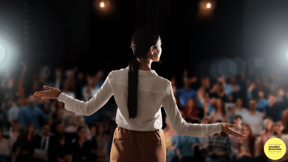 woman presenting on stage