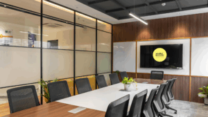 Boardroom table with screen with Mindful Presenter Logo on it