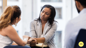 two women sitting talking