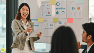 woman presenting and smiling