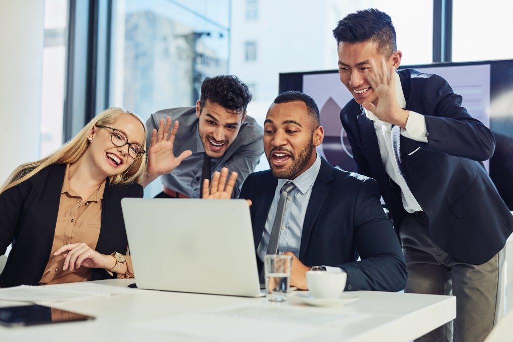 4 people gathered around the table for meeting around the globe