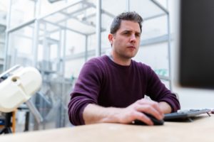 man looking at laptop