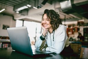 woman speaking on laptop