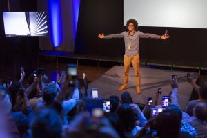 man presenting on stage