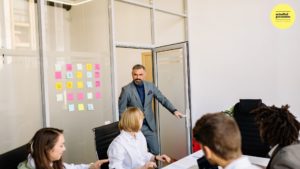 man walking into a meeting room