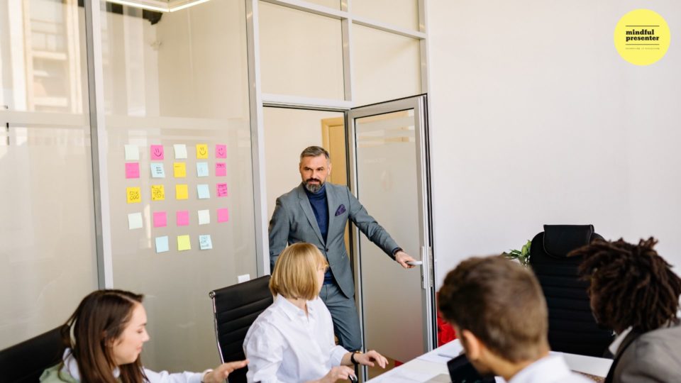 man walking into a meeting room