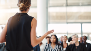 woman presenting to audience