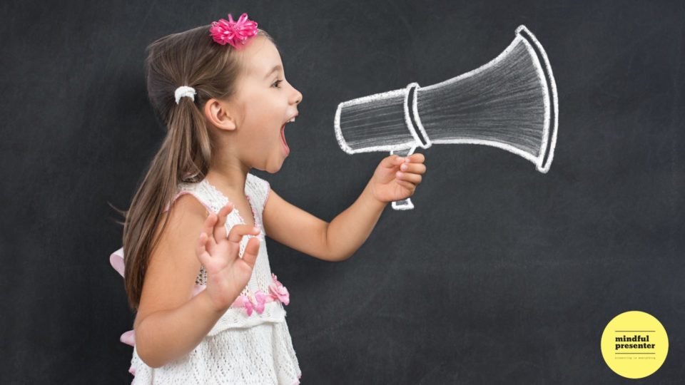 Young girl shouting into a sketched microphone