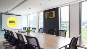 Emprty board room with Mindful Presenter Logo on screen