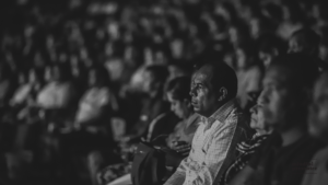 Black and white image of large audience