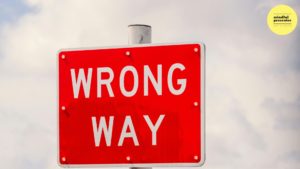 Road sign with the words wrong way written in whit on red background