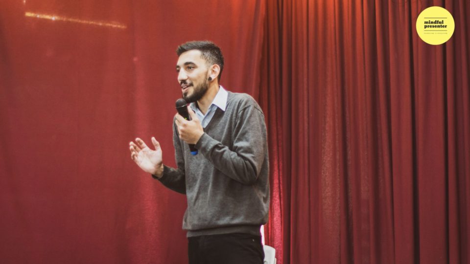 Man with microwave on stage
