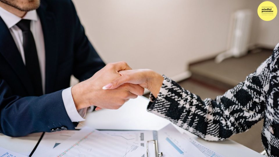 man and woman shaking hands