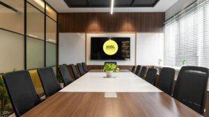 Boardroom with mindful presenter on logo