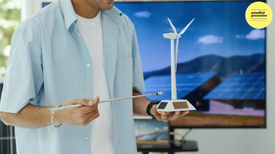 engineer holding model wind turbine